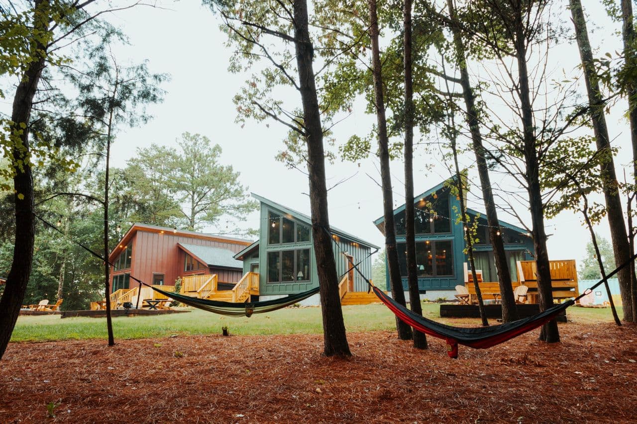 Cabins with hammocks in woods